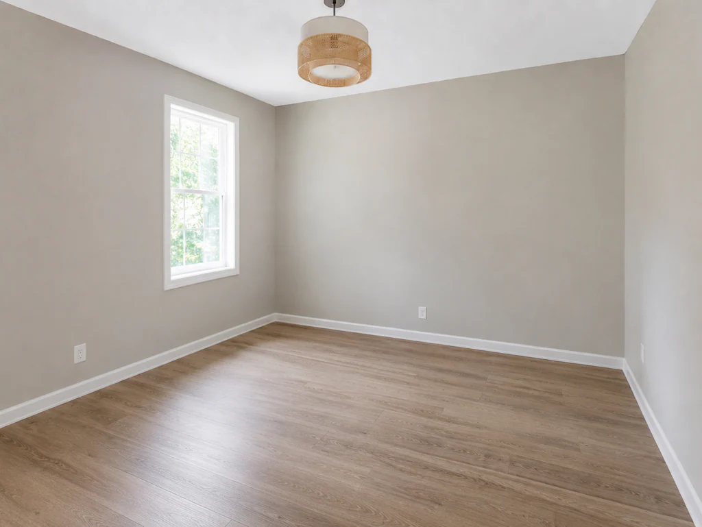 Kids' bedroom before virtual staging: bright room with a tall side window, shown empty.